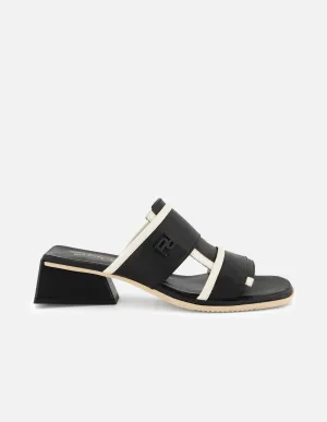 Mule de piel color negro para mujer con contraste en color blanco