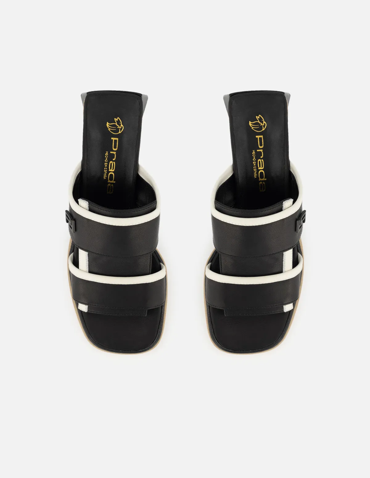 Mule de piel color negro para mujer con contraste en color blanco